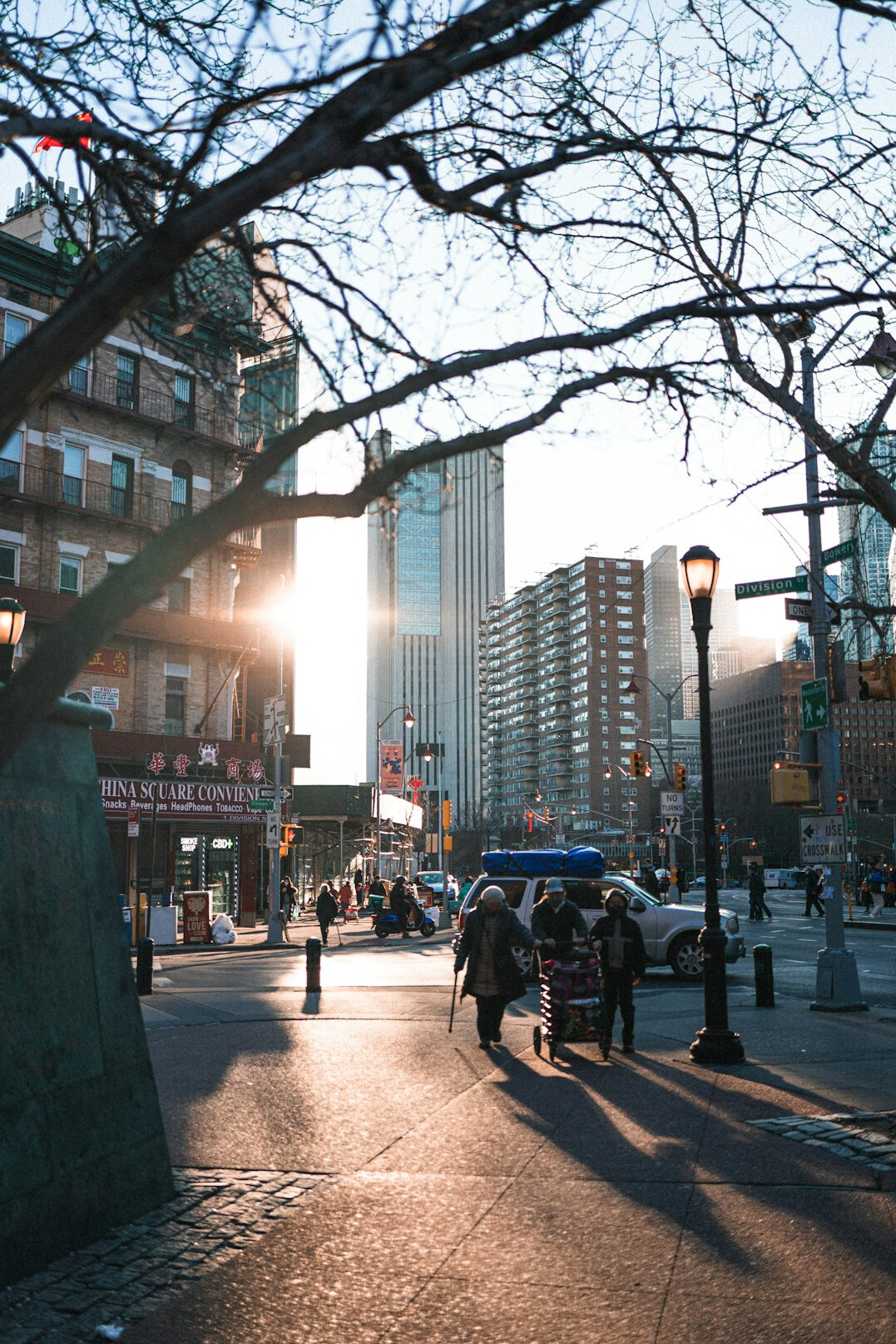 Person walking through a busy Canadian city street at golden hour