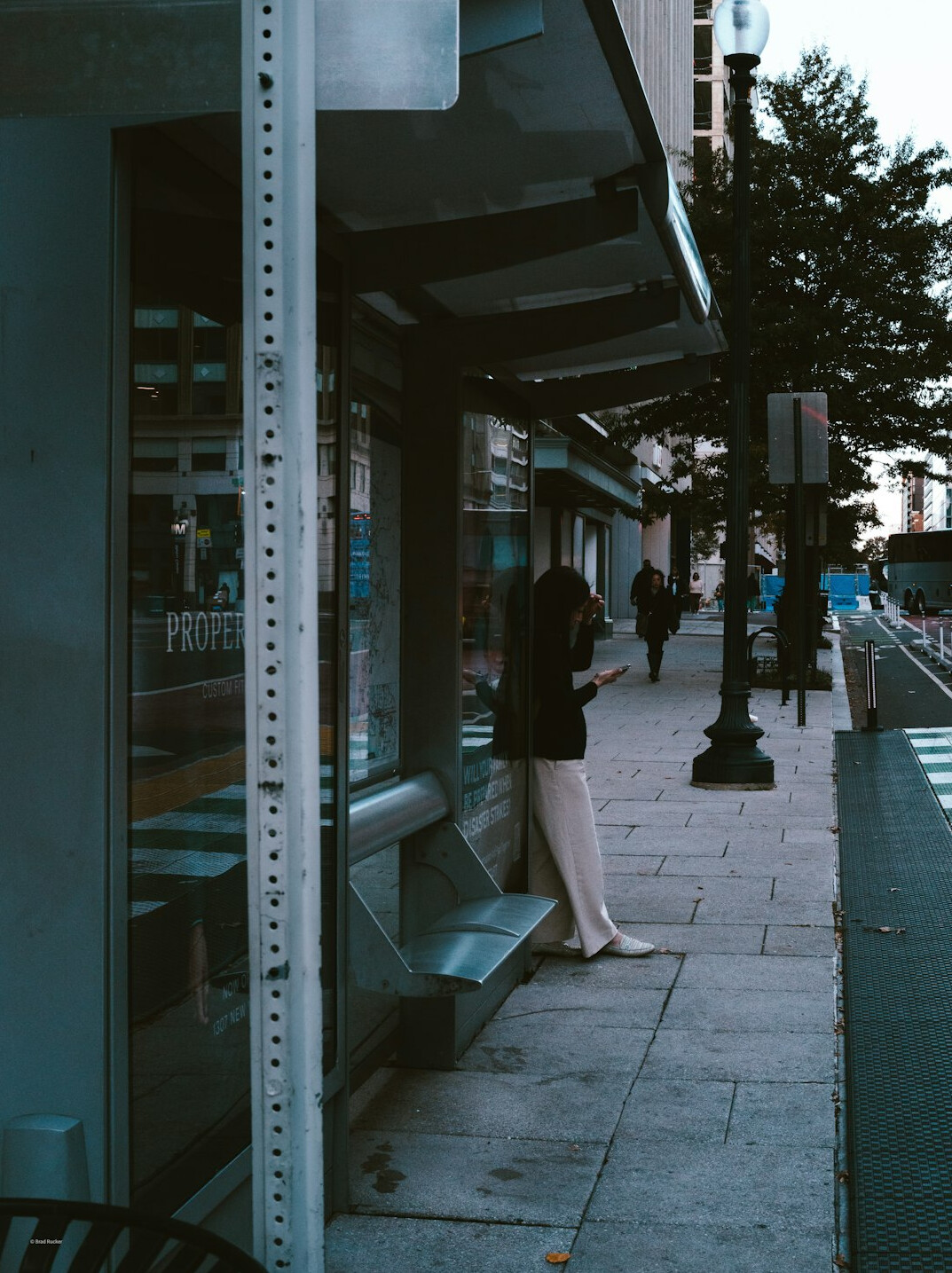 Two people having a conversation on a city sidewalk