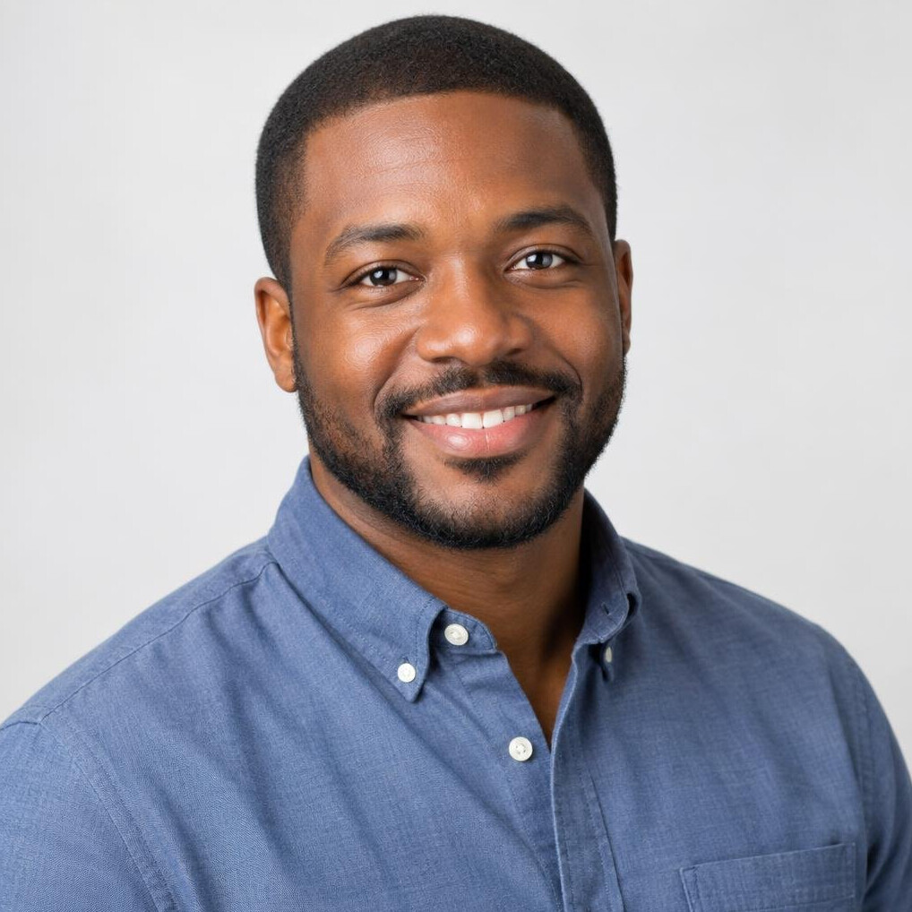 Studio portrait of a smiling man with short hair