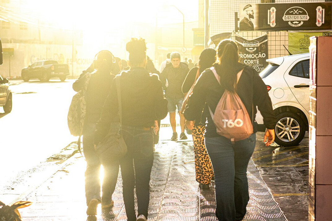 Diverse group of people walking together on a city street