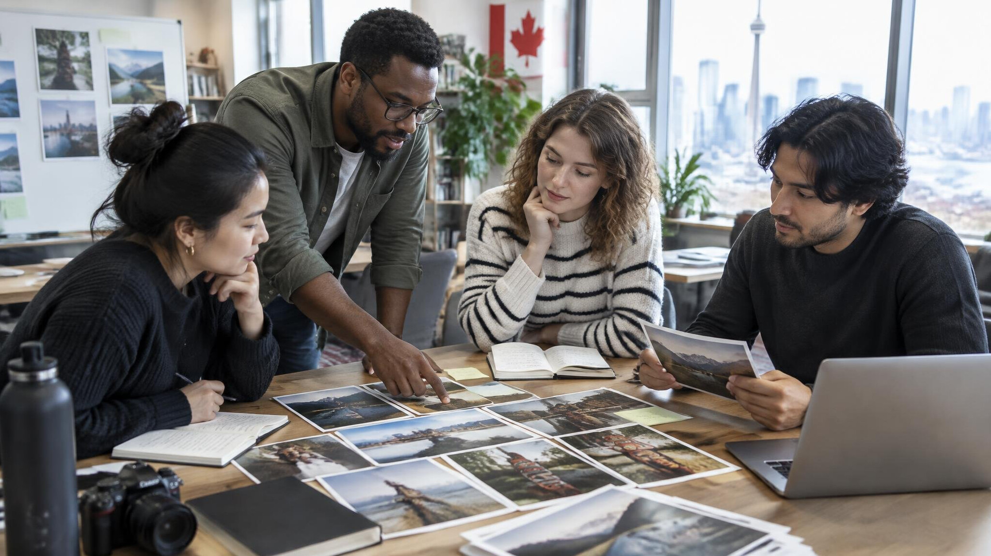 Small editorial team reviewing photographs around a table