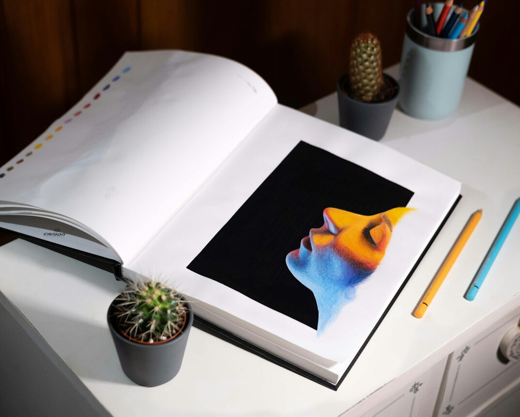 Editorial layout and photographs spread across a desk